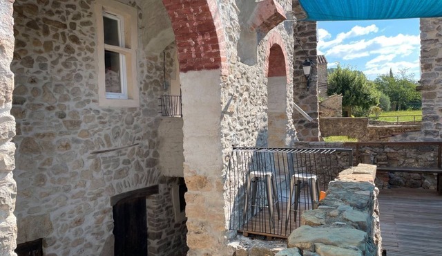 Atypical Cottage: Stone House Hosting an Art Gallery Cottage, Large Terrace