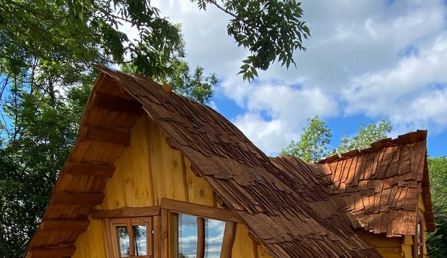 Atypical enchanted wooden cabin and heated outdoor pool