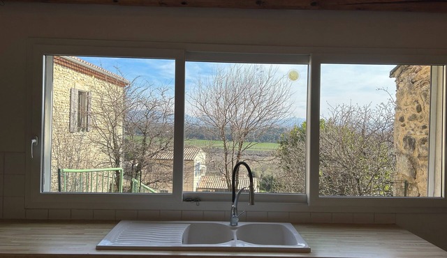 Atypical village house with terrace and garden near Grignan.