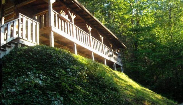 Authentic log home with hot tub, fireplace, fire pit and billiards !