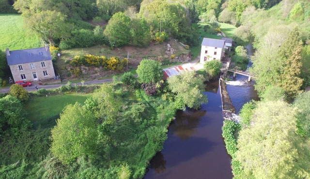 Authentic mill with feet in water (near the sea)