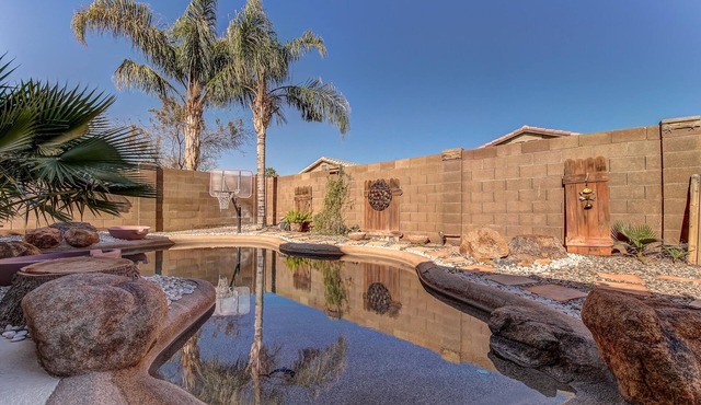 Backyard oasis with private solar heated pool, hot tub and tons of amenities!