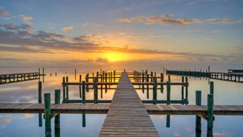 Balcony w Bay View Shared Pool Boat Dock Fat Flounder by AvantStay