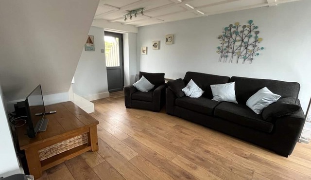 Barn conversion overlooking the golf course to the sea