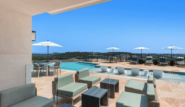 Barsala l Tranquil 1BD: Poolside Luxury, Smart Home Features