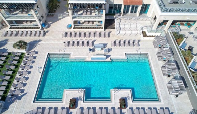 Bask in Modern Style Comfort! 2 City View Units, Beachfront Property w/Pool