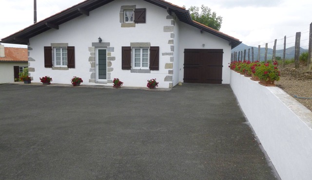 Basque house located between sea and mountains.