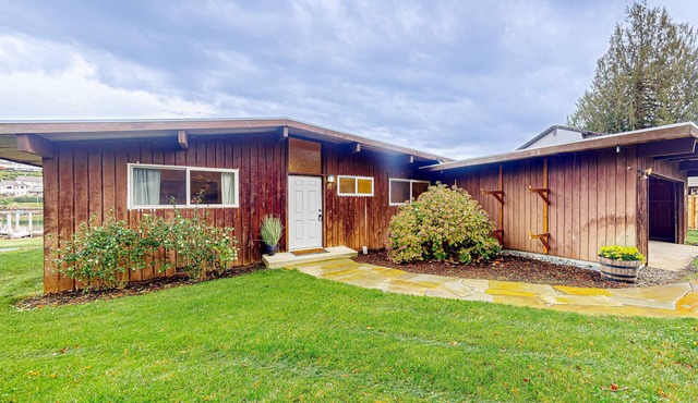 Bay-front dog-friendly home on one acre of land with modern interior & W/D