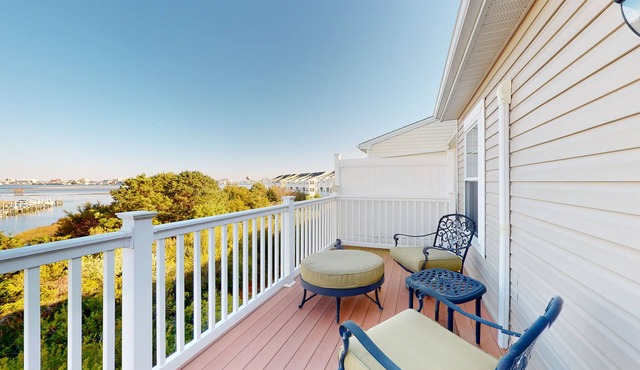 Bay-view townhome with pool & private outdoor living - walk to dining