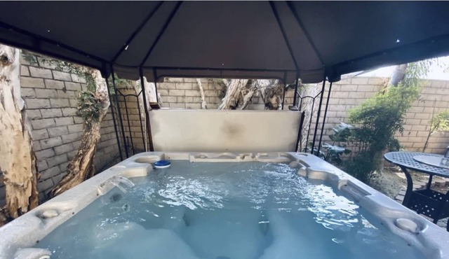 Beach Bliss: 4BR Oasis & Jacuzzi