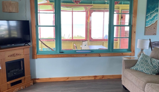 Beach-front 3 bedroom cottage with private access to a family-friendly beach.