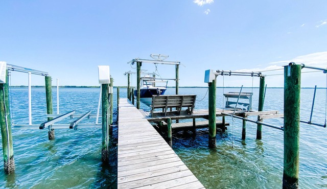BEACH FRONT to BAY with boatdock, swimming pool, pickleball courts and kayaks.