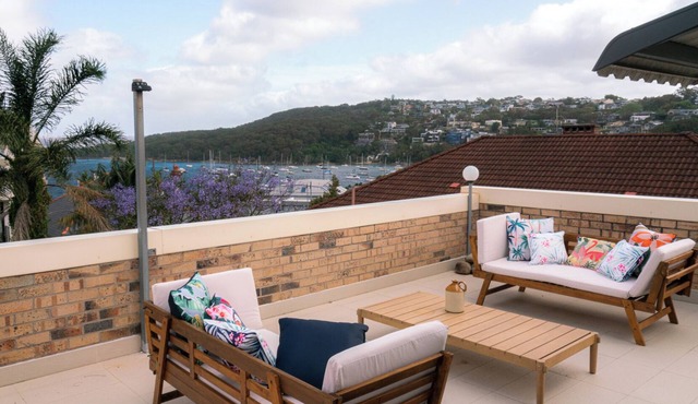 Beach getaway with rooftop terrace & harbour views, Walk to beaches & cafes.