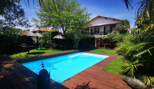 "Beach House" in SW France, tropical garden, pool and room for 27 people.