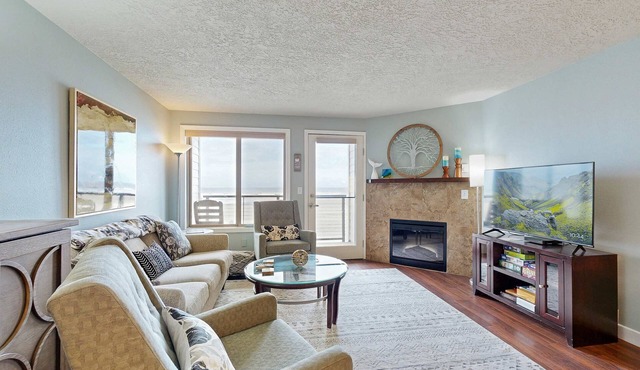 Beachfront condo boasting beautiful views a private balcony and perfect location