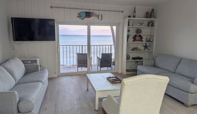 Beachfront townhome. Steps to the beach, dock, pool, and tennis w/pickle ball.