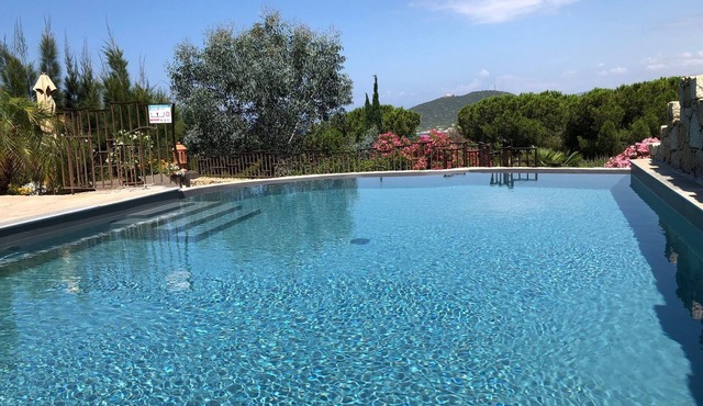 Beachfront villa with private heated pool, terrace and sea view