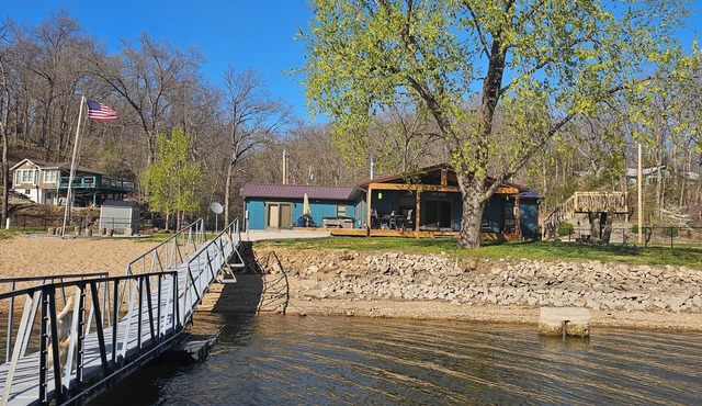 Beautiful 4 bedroom 2 bathroom lakeside cabin with large dock and sandy beach.
