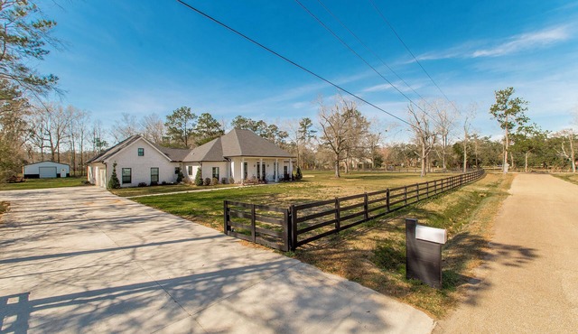 Beautiful 4 bedroom 3 1/2 bath home sitting on a fenced in 2 acre lot