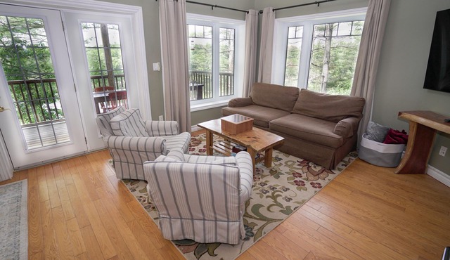 Beautiful 5 bedrooms waterfront cottage sits on a private 4 acres wooded lot!
