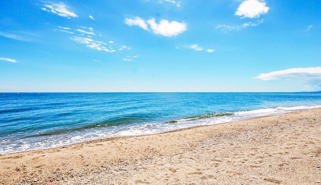 Beautiful and modern vacation home with communal pool and sea view from the terrace.