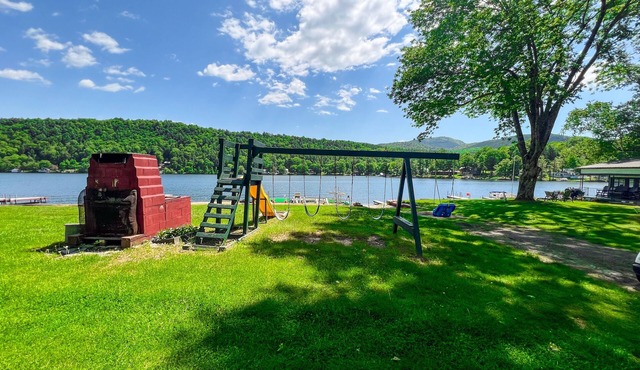 Beautiful and serene cottage with beach, dock, lake views, fishing, and A/C