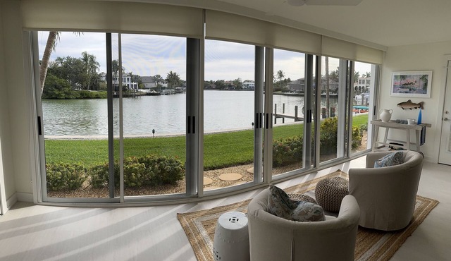 Beautiful bayfront condo in paradise directly across from beach with boat dock