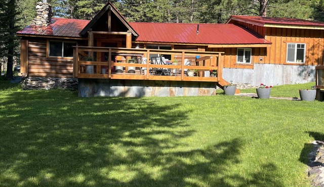 Beautiful cabin with a creek running through it.
