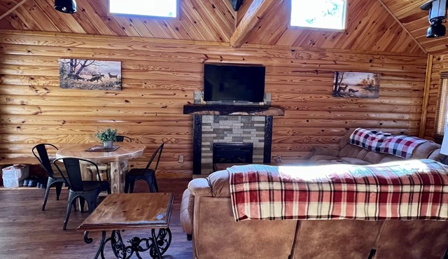 Beautiful cabin with fireplace and wrap around porch and private upstair balcony