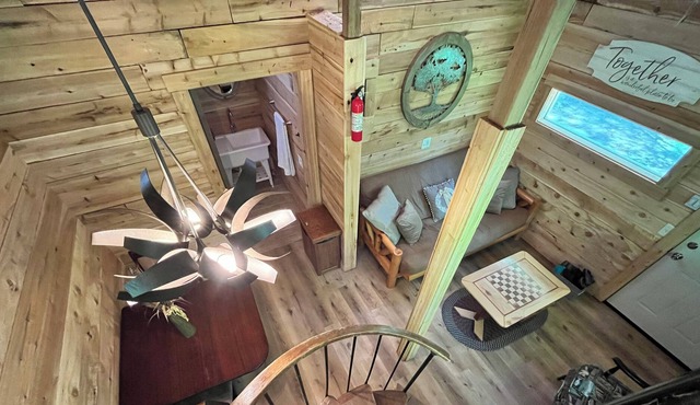 Beautiful cedar treehouse that has wall-to-wall windows, forest and river view!
