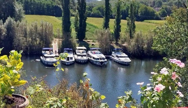 Beautiful character house overlooking Le Lot. nRiverside location with slip.