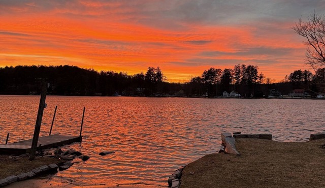 Beautiful contemporary home with a dock on Lake Winnisquam