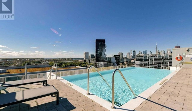 Beautiful corner unit with floor to ceiling windows in prime South Riverdale