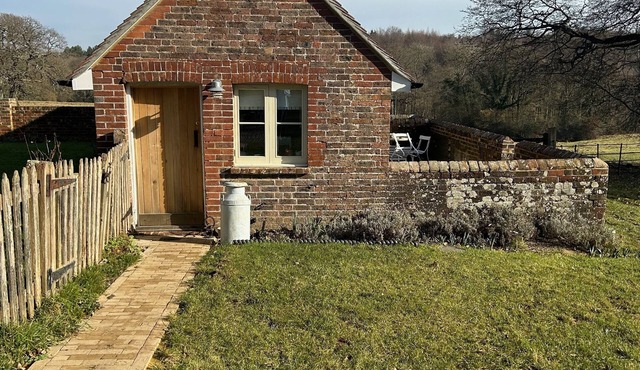 Beautiful cosy converted pigsties , set in 80 acres of woodland and meadows .