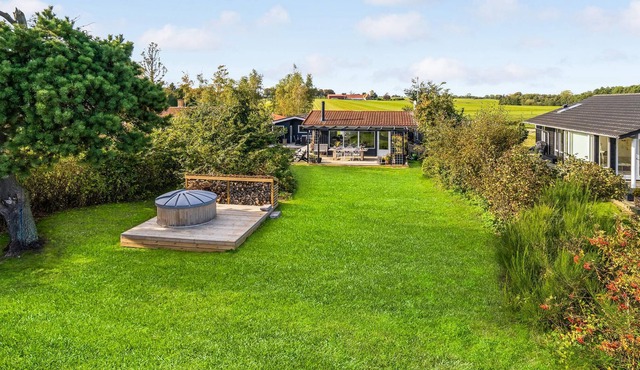 Beautiful cottage in the greenery with sea view, located in a small cottage area.