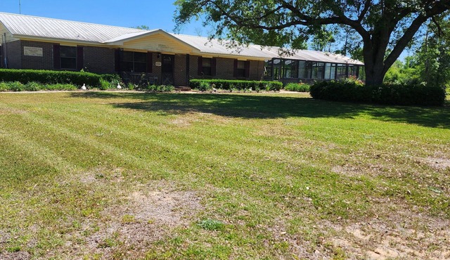 Beautiful country home in nice setting. Surrounded by gorgeous gardens.