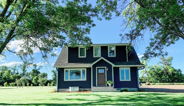 Beautiful cozy country home located on 12 acres in a great farming community.