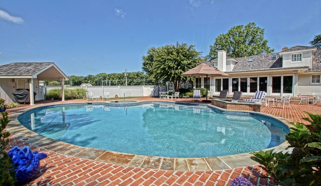 Beautiful custom home on 1.5 acres with large heated saltwater pool and spa!