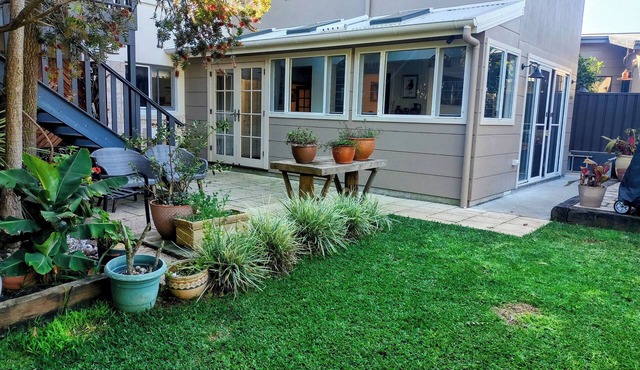 Beautiful eclectic studio with lush private garden and solar heated pool