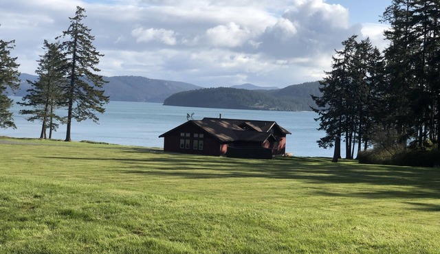 Beautiful farmhouse overlooking water with beach access on a private estate
