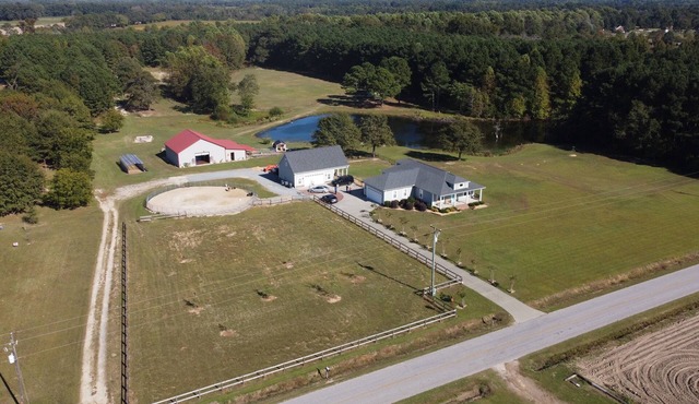 Beautiful Farmhouse with 5 bedrooms on 24 acres of serenity in marvelous Benson.