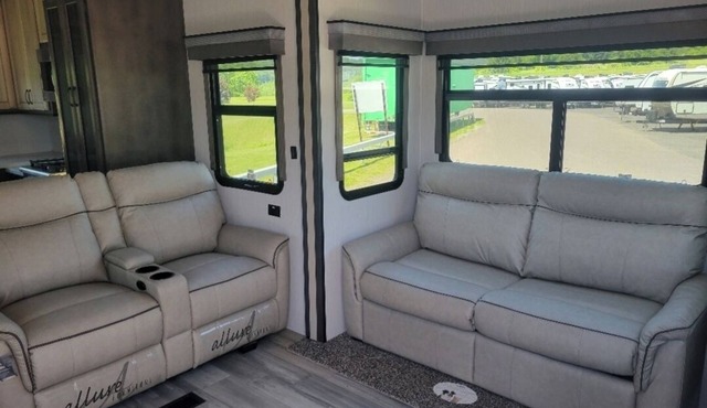 Beautiful fifth wheel by the river