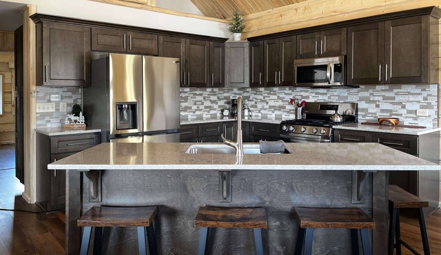 Beautiful hand-crafted log cabin on Horse Creek one block off Main Street.