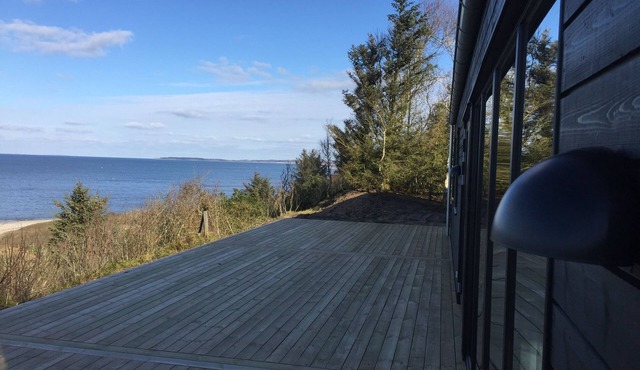 Beautiful holiday home located at the 1st row by the fjord.