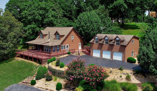 Beautiful Home on 18 acres with view of Beaver Lake and lake access.