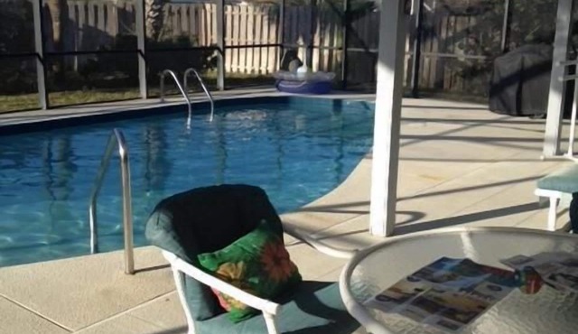 Beautiful home steps to the beach with year round heated pool and spacious lanai