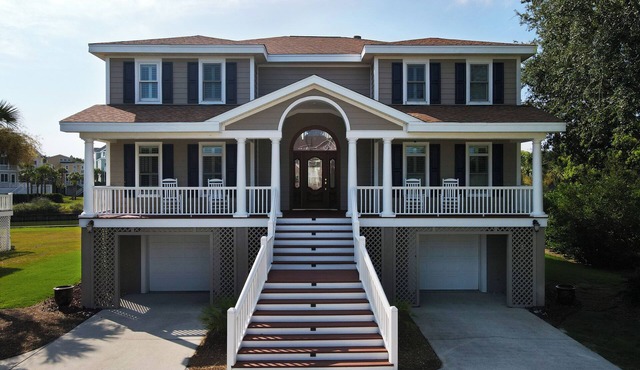 Beautiful home with open porches overlooking lagoon in Wild Dunes
