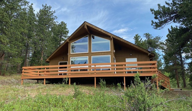 Beautiful house on 10 acres with large deck overlooking private meadow.