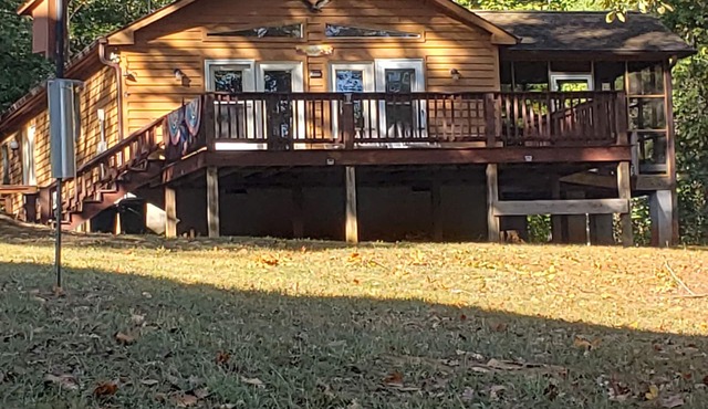 Beautiful Lake Cottage with water access, private dock in cove and fire pit