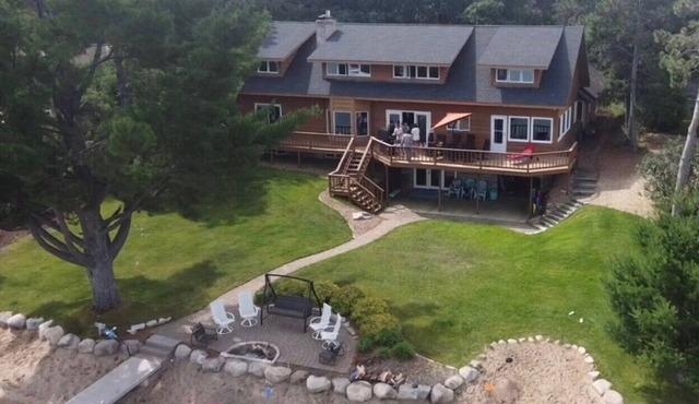 Beautiful lake home on the sandy south shores of Pelican Lake.